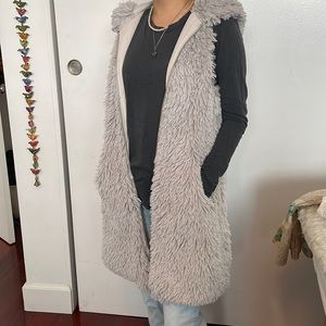 Unique Festival Ware, grey faux fur hooded vest with pockets size small.